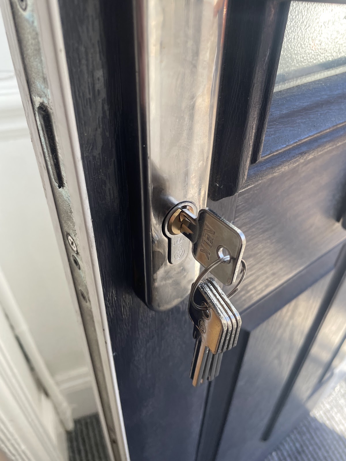 New cylinder and keys fitted to a black front door in South Shields